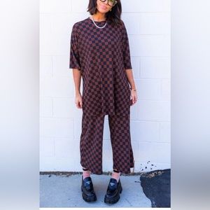 Dressed in Lala Lex Ribbed Checkerboard Playsuit in Black + Mocha